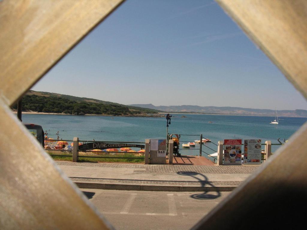 Borgo Spiaggia Vista Mare Isola Rossa Bagian luar foto